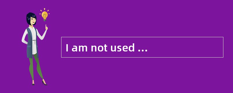 I am not used to speaking ________ public.